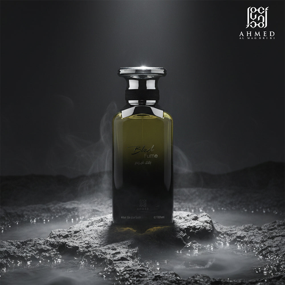 Black Fume perfume bottle on dark rocks